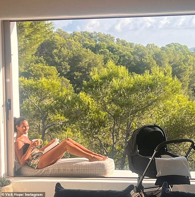 The Radio 1 DJ was seen enjoying reading her book in the sunshine while her newborn slept in his pram nearby