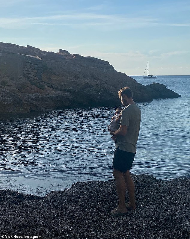 DJ Calvin was seen cradling his son by the ocean