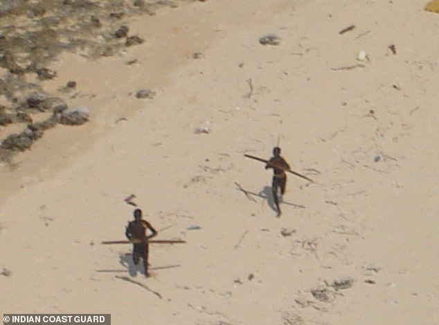 This rare picture, shot from a helicopter by Indian Coast Guard, shows Sentinelese tribesmen on North Sentinel Island on the Andaman and Nicobar Islands