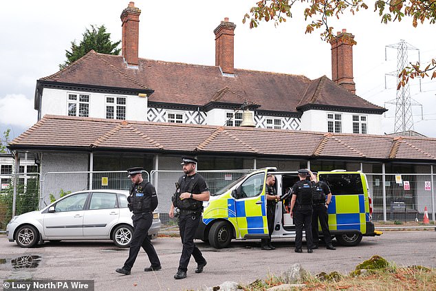 Committee chair Dame Karen Bradley MP said the Home Office has 'presided over a failing asylum accommodation' (Pictured: Police outside the Bell Hotel in August 2025)