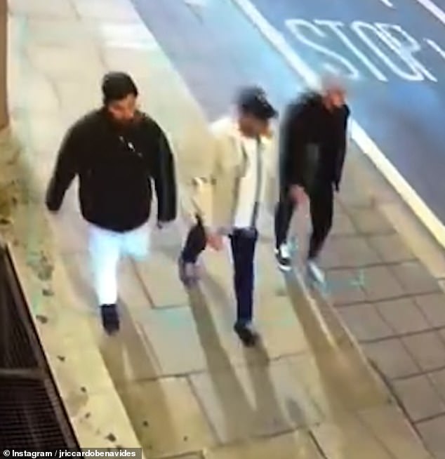 Three men can initially be seen strolling down the street before the taxi carrying the business man pulls up