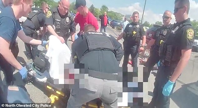 Paramedics hoisted Julian on to a stretcher and began CPR, his life draining away from wounds to his back and cheek