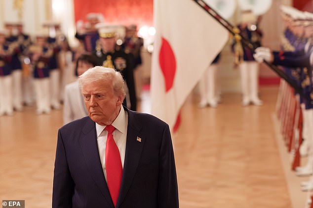 President Donald Trump reviews an honor guard during a welcome ceremony Tuesday morning at the Akasaka Palace in Tokyo, Japan