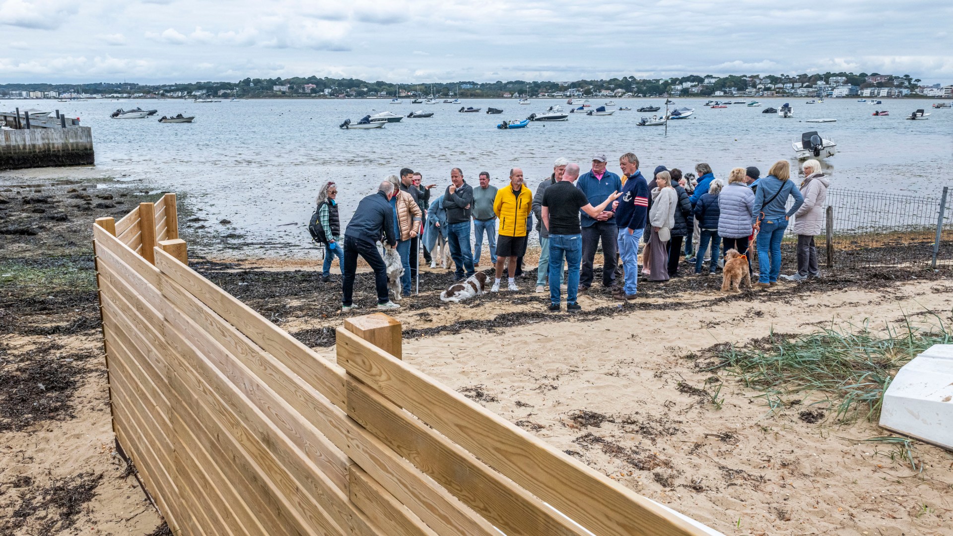 Millionaire neighbours locked in bitter row over 'oppressive' 40ft privacy fence suddenly built on popular UK beach