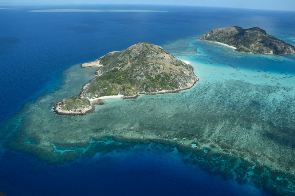 Aerial view of the lagoon and coral reefs adjacent to Lizard Island, Great Barrier Reef, Australia.