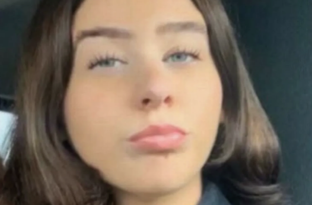 Emily Whittaker, a woman with blue eyes and brown hair, looking at the camera.