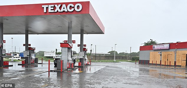 epaselect epa12486751 A gas station and nearby businesses are boarded up ahead of the imminent impact of Hurricane Melissa in Port Henderson, St. Catherine, Jamaica, 27 October 2025. Jamaican Prime Minister Andrew Holness said the government has a multifaceted plan to ensure a 'swift and effective' response to the storm, expected to hit the island on Monday night and forecast to be the island's strongest recorded storm.  EPA/RUDOLPH BROWN