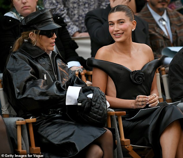 The Flowers singer was seen chatting to Hailey Bieber in the front row, also donning a matching leather look