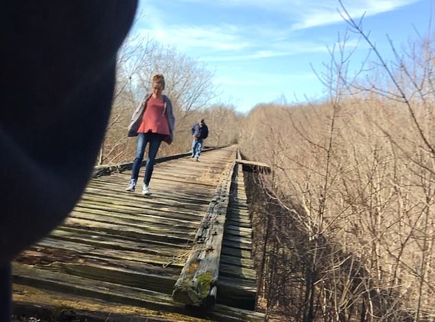 Haunting video captured on Libby's cellphone shows 'Bridge Guy' following Abby along the abandoned bridge