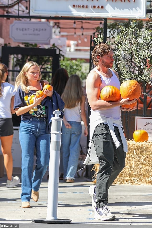 However, it was Christopher who no doubt turned heads as his impressive weight loss was on full display in a white tank top