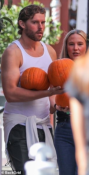 Juggling multiple pumpkins did not seem like such a major task with his muscular arms