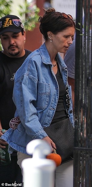 Katherine kept her look simple in a denim chore coat