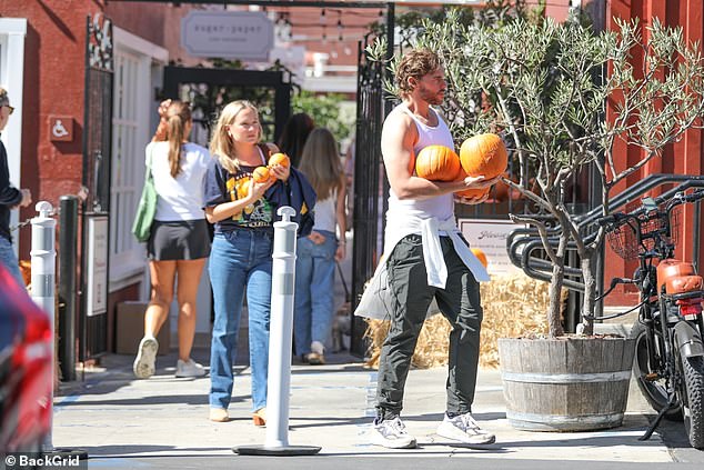 Her blonde locks were worn down in a middle part as she accentuated her natural looks with complementary make-up