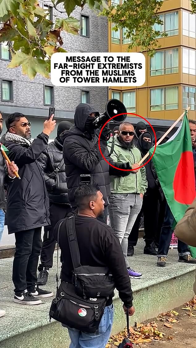 He was filmed on stage alongside a megaphone-wielding speaker as people were rallied to 'stand firm'