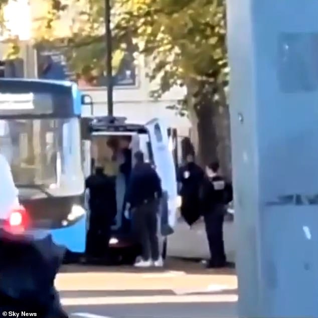 Footage shows Kebatu being bundled into the back of a police van after being arrested in Finsbury Park