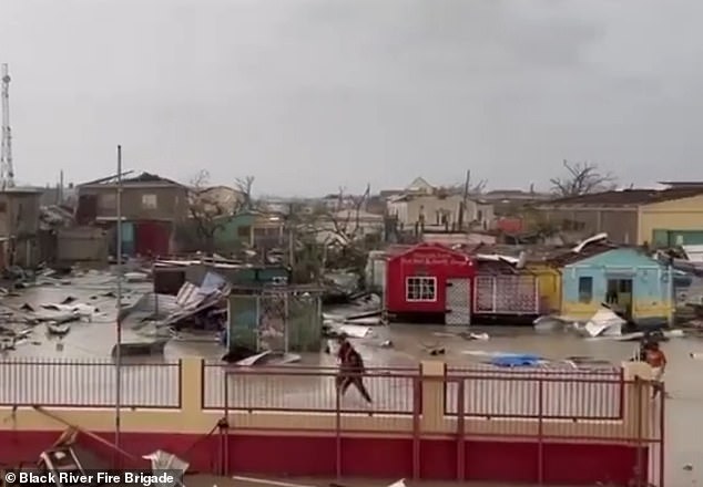 Horrifying video shows colorful buildings submerged in murky floodwaters, while others were destroyed entirely, in Jamaica