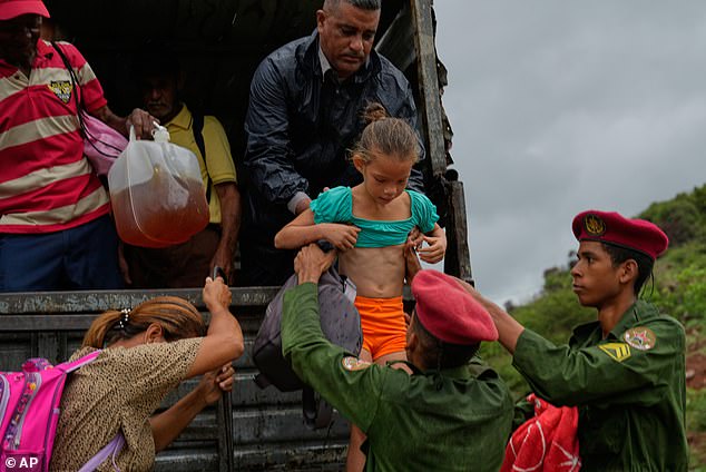 Children were evacuated from their homes with the assistance of military personnel in Cuba