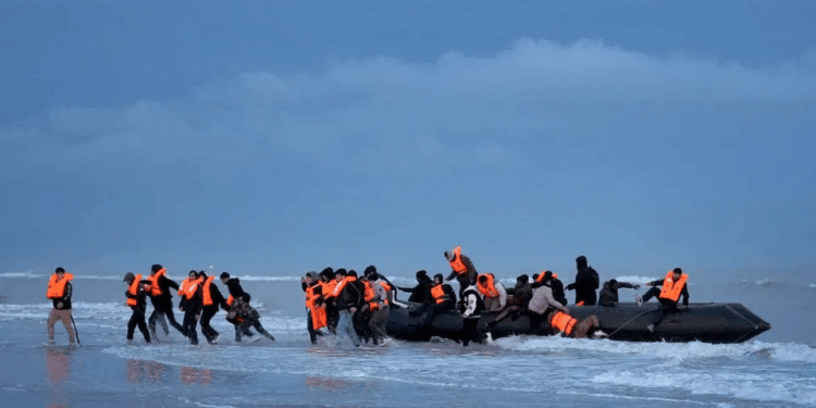 Migrant who re-entered Britain on small boat after being deported under 'one in, one out' deal is STILL in UK