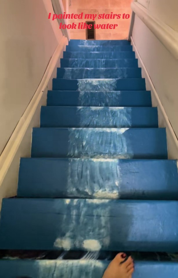 A staircase painted to look like a waterfall.