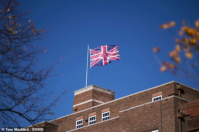 A smaller Union flag is also positioned on the roof of the building in defiance against the council