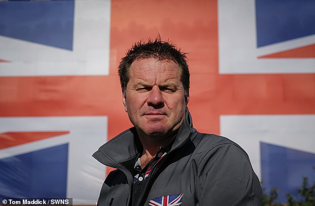 James Holmes spent £2,500 on the huge flag after the council ordered him to tear his old one down