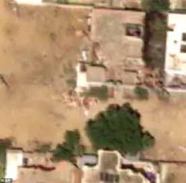 Bodies and blood: Body-sized objects were seen in the satellite images clustered around vehicles and nearby an RSF sand berm built around the city