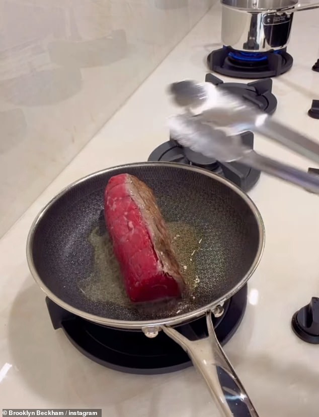 The eldest son of David and Victoria chopped up and sautéed mushrooms before sealing his beef in the frying pan and covering it with Dijon mustard