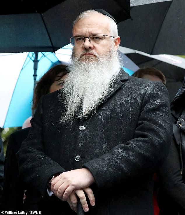 Rabbi Daniel Walker at a vigil outside his synagogue following the attack