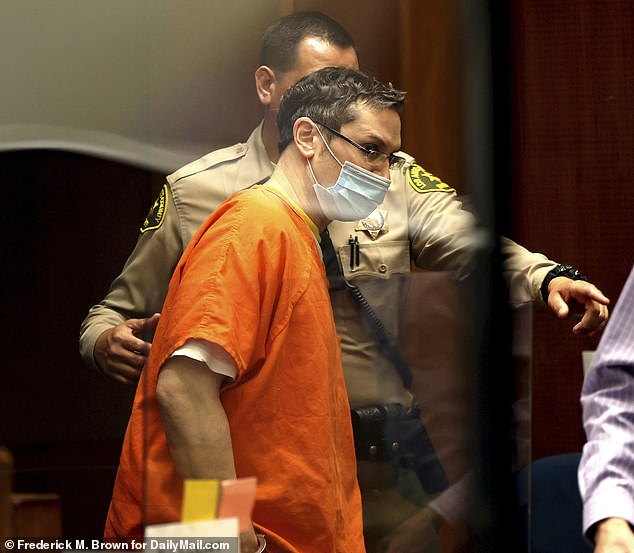 Pearce is seen in orange prison clothing as he entered Los Angeles Superior Court in July 2022