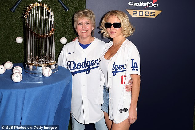 At the game, she was seen posing with Martin next to the last season's World Series trophy after the Dodgers upset the New York Yankees in 2024