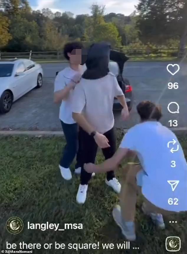 Nomani posted a separate video from the same association at Langley High School in McLean, showing members putting a bag over a student¿s head after he said he wouldn¿t attend the meeting (pictured)