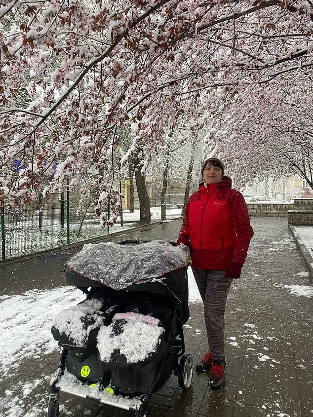Natalia (pictured with her newborn twins) said that 'having children overshadowed all the hardships' that the war imposed