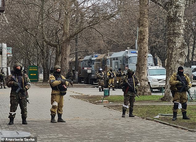 Pictured: Anastasiia photographed the armed Russian soldiers lining the streets of Kherson during the occupation at the beginning of the war in 2022