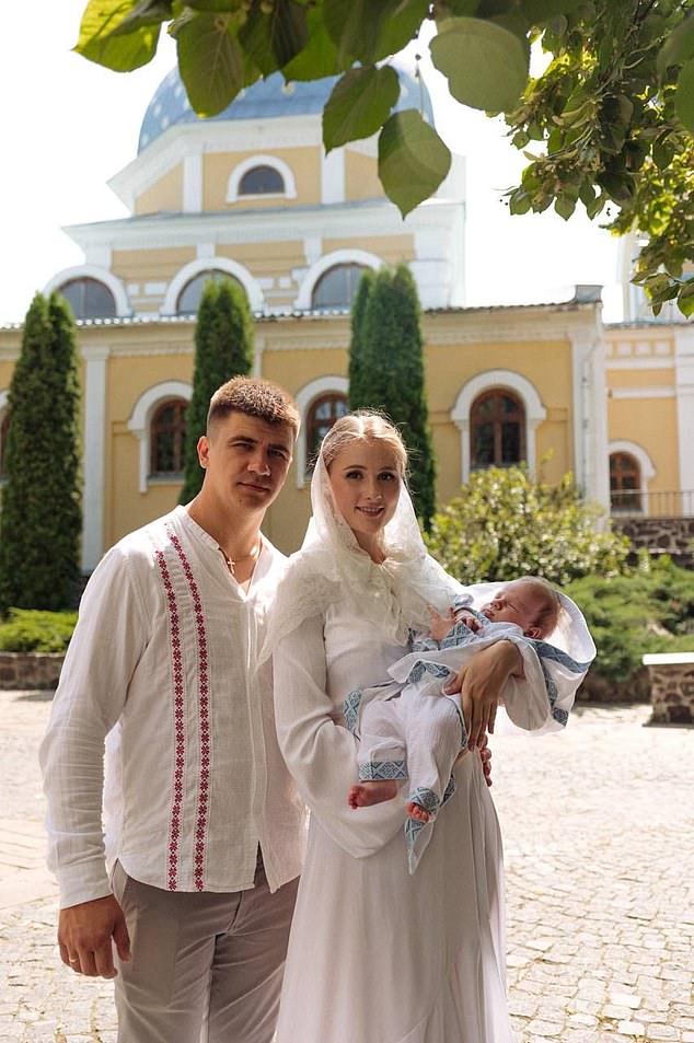 Alyona (pictured right) with her husband (pictured left) and newborn son, who she gave birth to in Kyiv in 2024