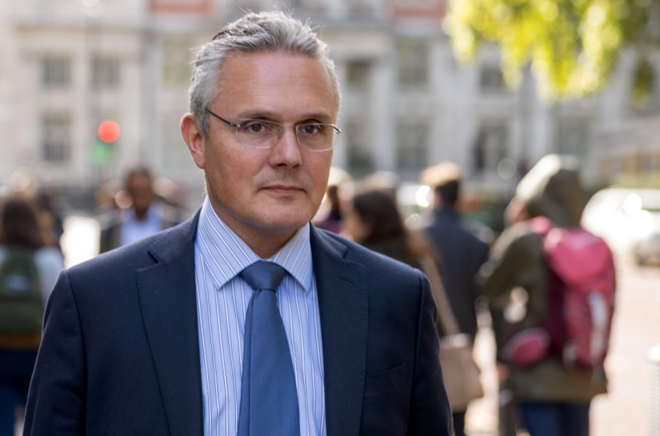 Mike Regnier, UK CEO of Santander, in a suit and tie.