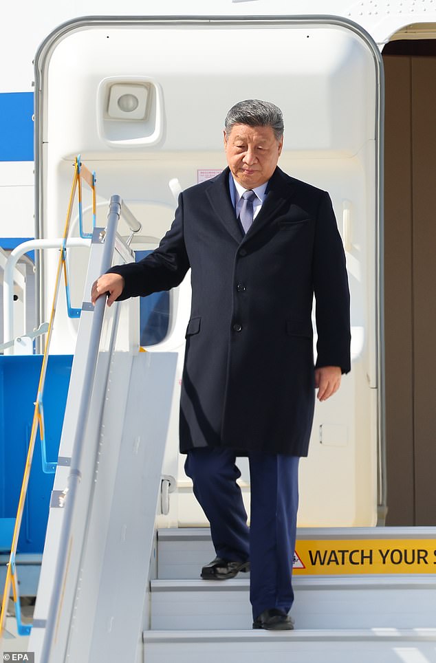 Chinese President Xi Jinping disembarks from a government plane upon arrival at Gimhae