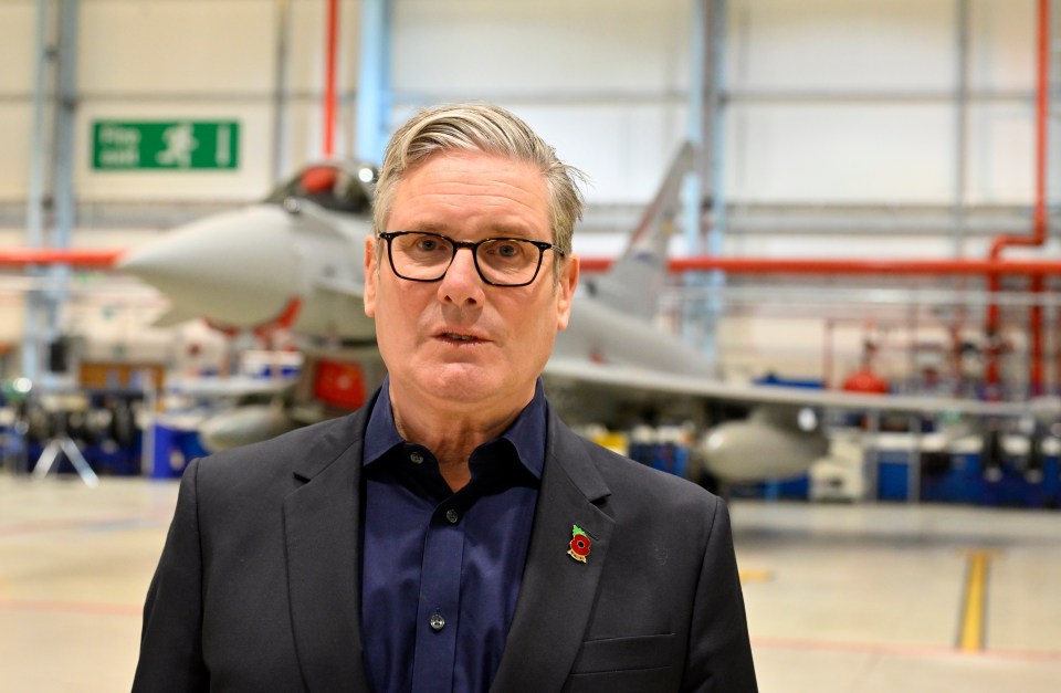 Keir Starmer at BAE Warton, with a Typhoon fighter jet in the background.