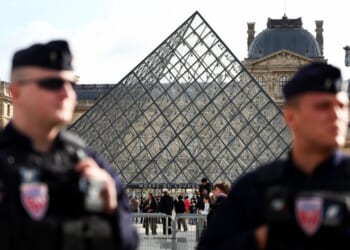 Third suspect arrested over Louvre £76m heist after two burglars charged with robbery