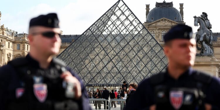 Third suspect arrested over Louvre £76m heist after two burglars charged with robbery