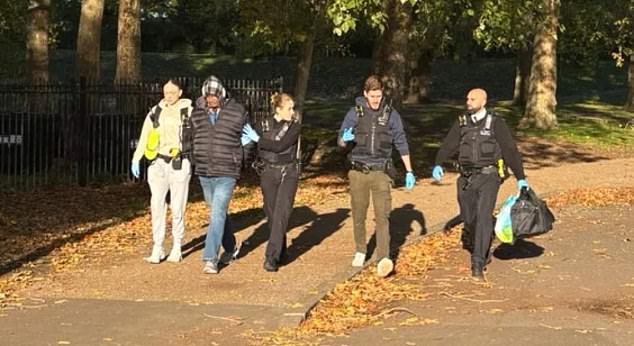This is the moment Hadush Kebatu (second from left) was arrested by Met Police officers in Finsbury Park, north London