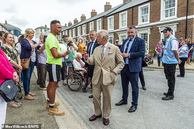 King Charles is seen meeting residents on a visit to Poundbury