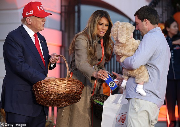 The duo delighted children who lined up decked out in costumes to meet with them