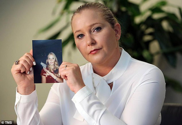 Andrew paid a reported £12million settlement to his sex abuse accuser Virginia Giuffre (pictured, with a picture of herself as a teen) in March 2022, halting the civil trial she had launched in the US
