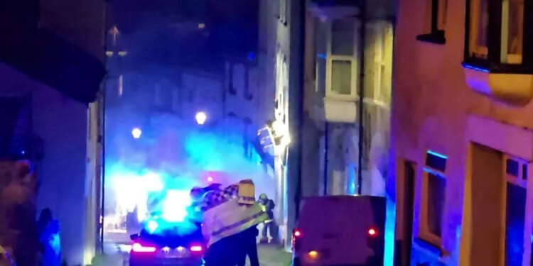 Four boys and a girl arrested for arson after man in his 30s dies in house fire as cops launch murder probe