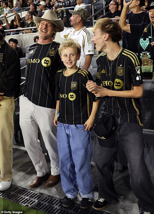 The Wedding Crashers star, 56, looked to be in great spirits as he watched the game with his boys, Ford, 14, and Finn, 11, wearing matching jerseys as they rooted for the Los Angeles Football Club in their showdown against Austin FC on Wednesday