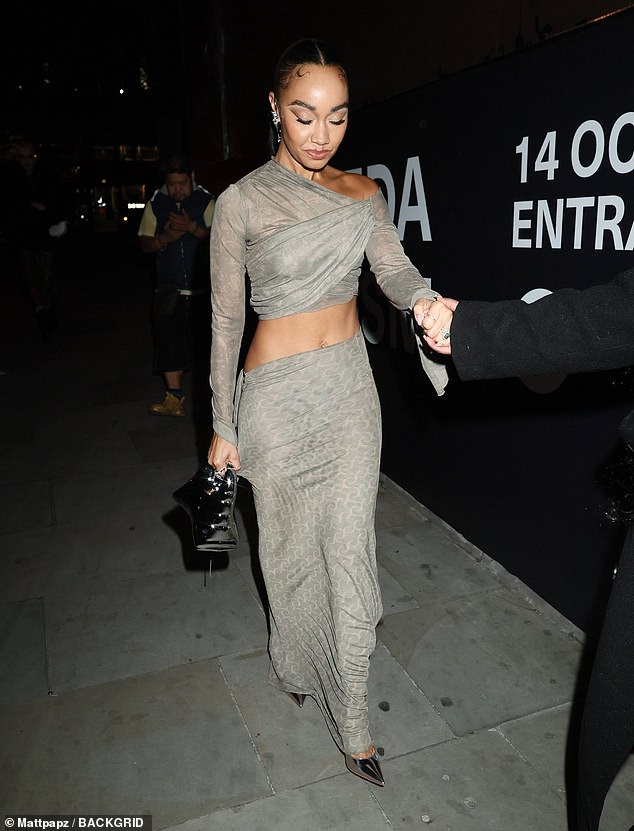 Leigh Anne Pinnock, 34, showed off her toned abs in a racy cut-out dress as she made an exit