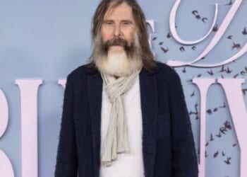 TV legend, 72,  looks unrecognisable with long grey beard as he hits the red carpet