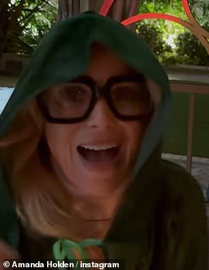 The BGT judge, 54, donned the show's green cape and a pair of the comedians glasses for the fun snaps alongside daughters Lexi, 19, and Hollie, 13