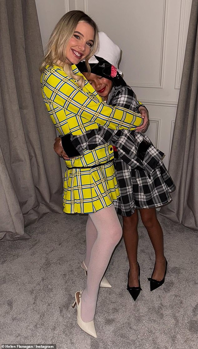 The former Corrie actress looked stylish in the iconic yellow plaid co-ord while her eldest wore black and red, complete with a hat