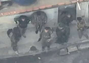 How battle of Rio unfolded as footage shows armed-to-the-teeth cartel commandos fleeing cops through bloodsoaked streets